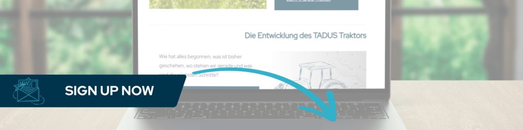 The image shows an open laptop displaying the TADUS website.